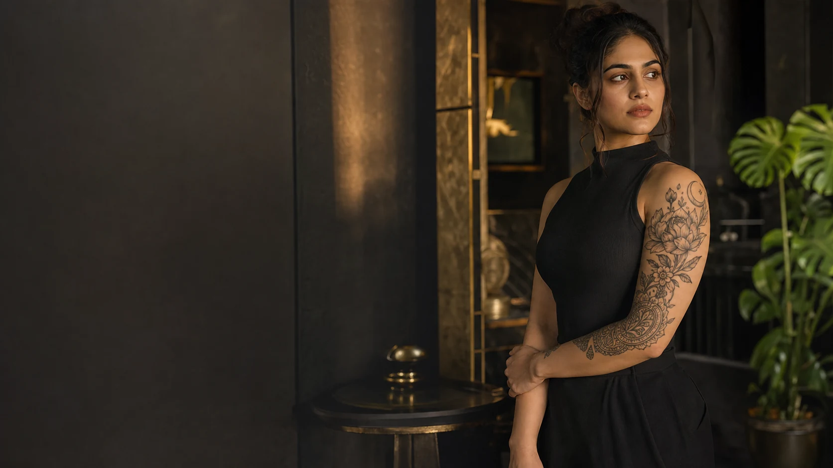 Woman with ornamental botanical tattoo in a luxury studio