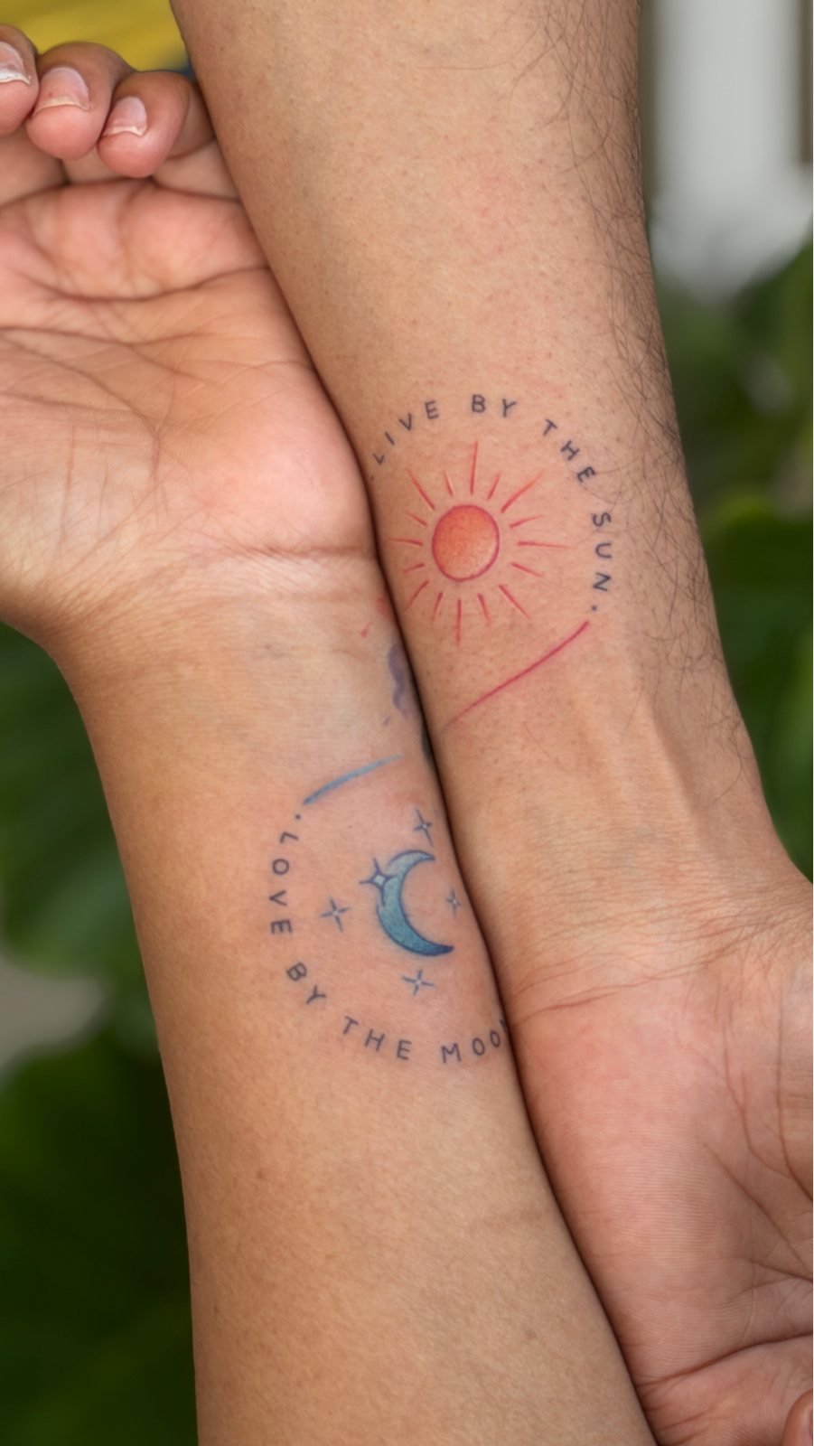 Couple sun and moon wrist tattoos