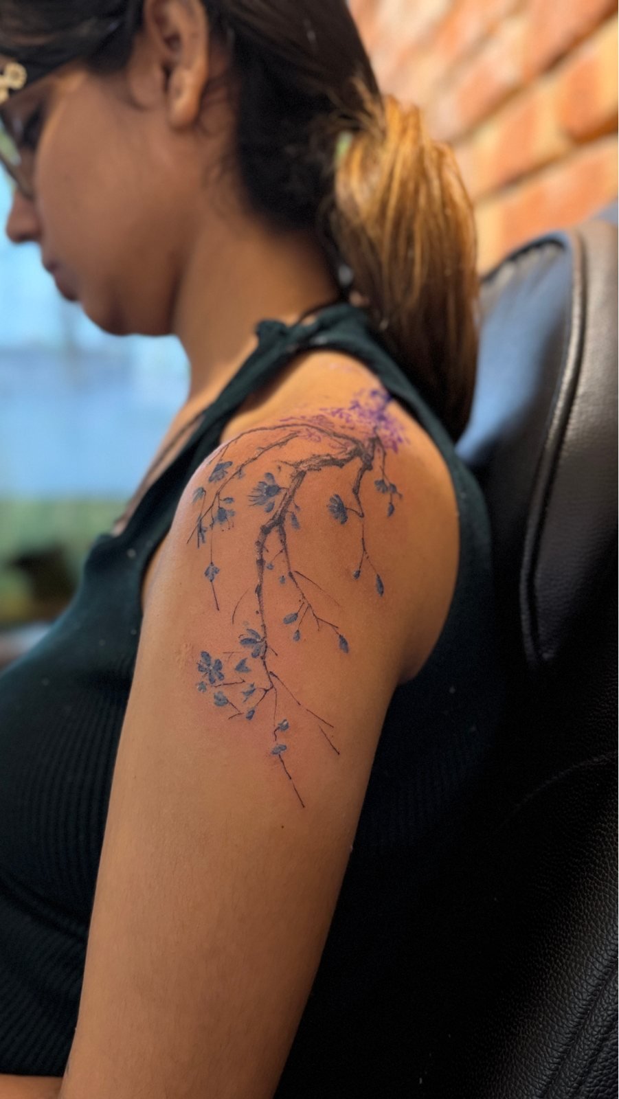 Fine line floral shoulder tattoo