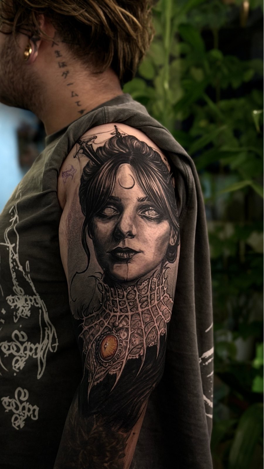 Black and grey portrait shoulder tattoo