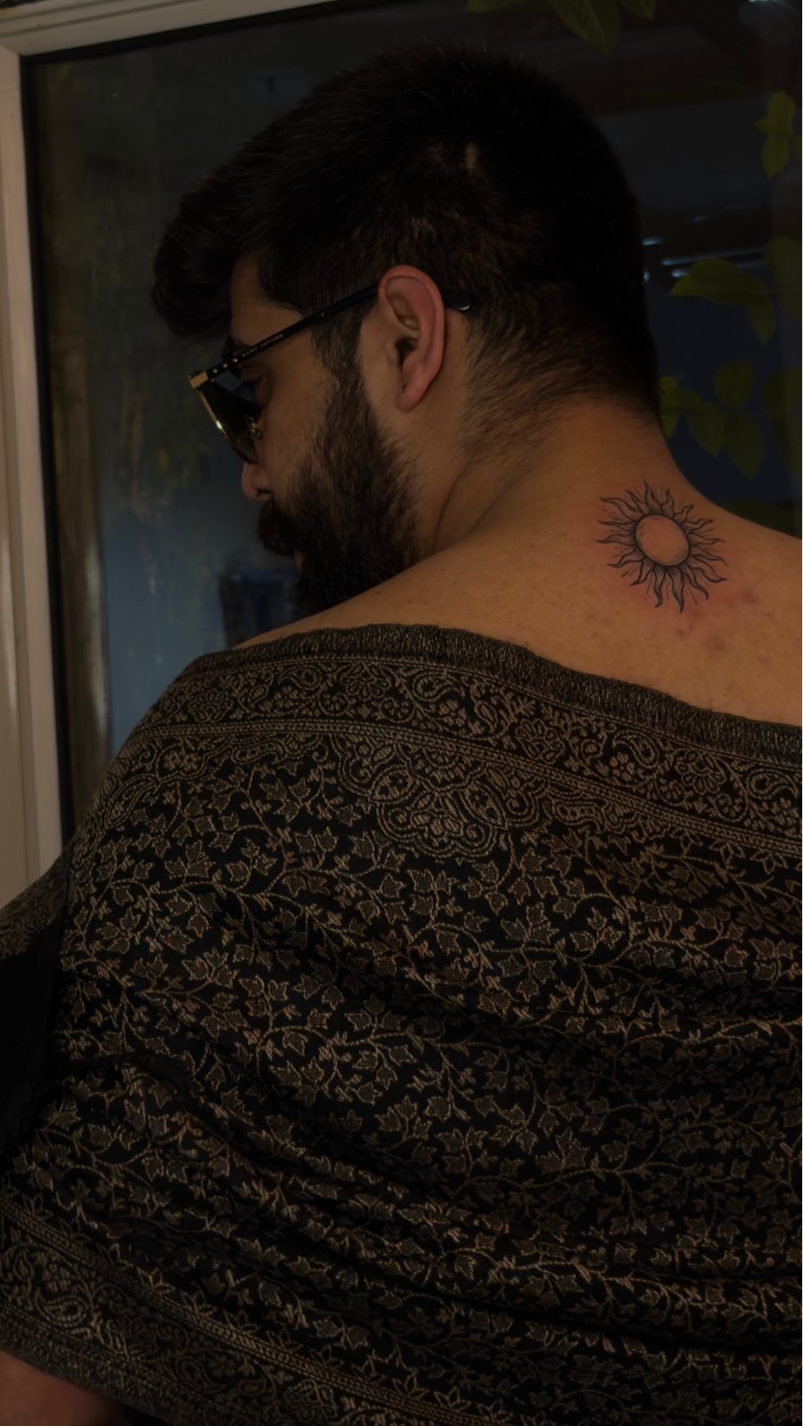 Minimal sun shoulder tattoo